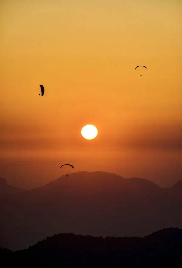 A paraglider flying above Bir Billing